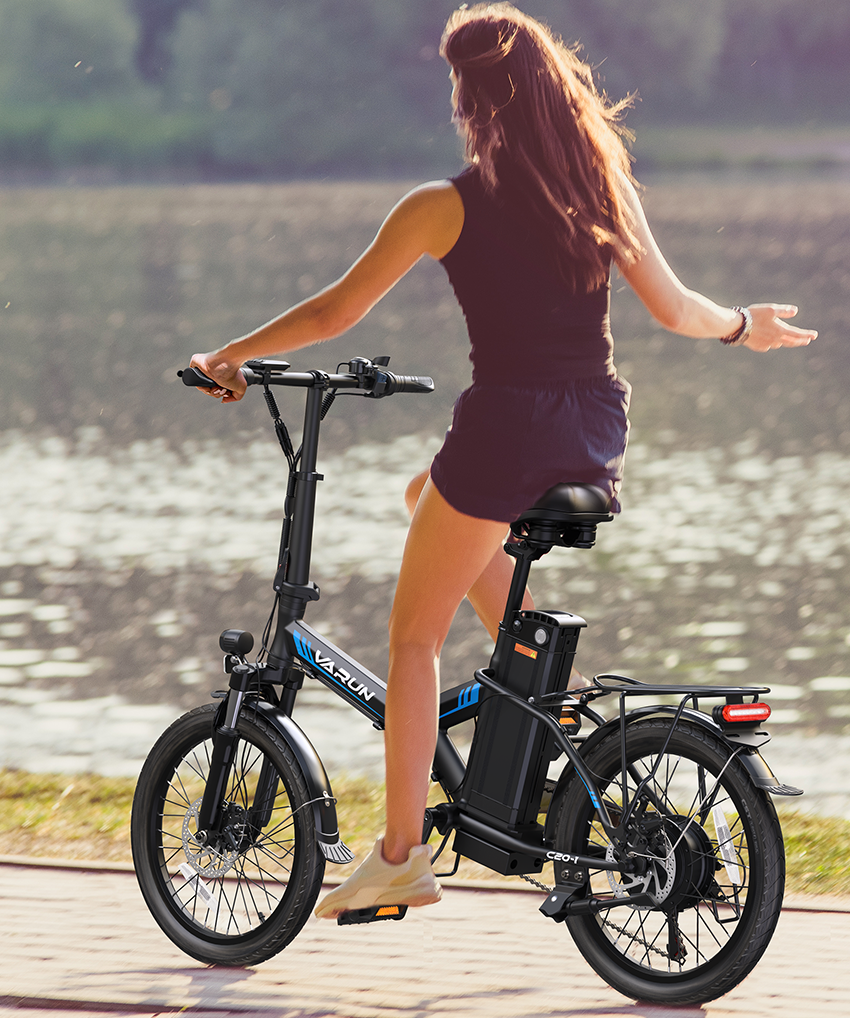 The woman ride the bike with ease.