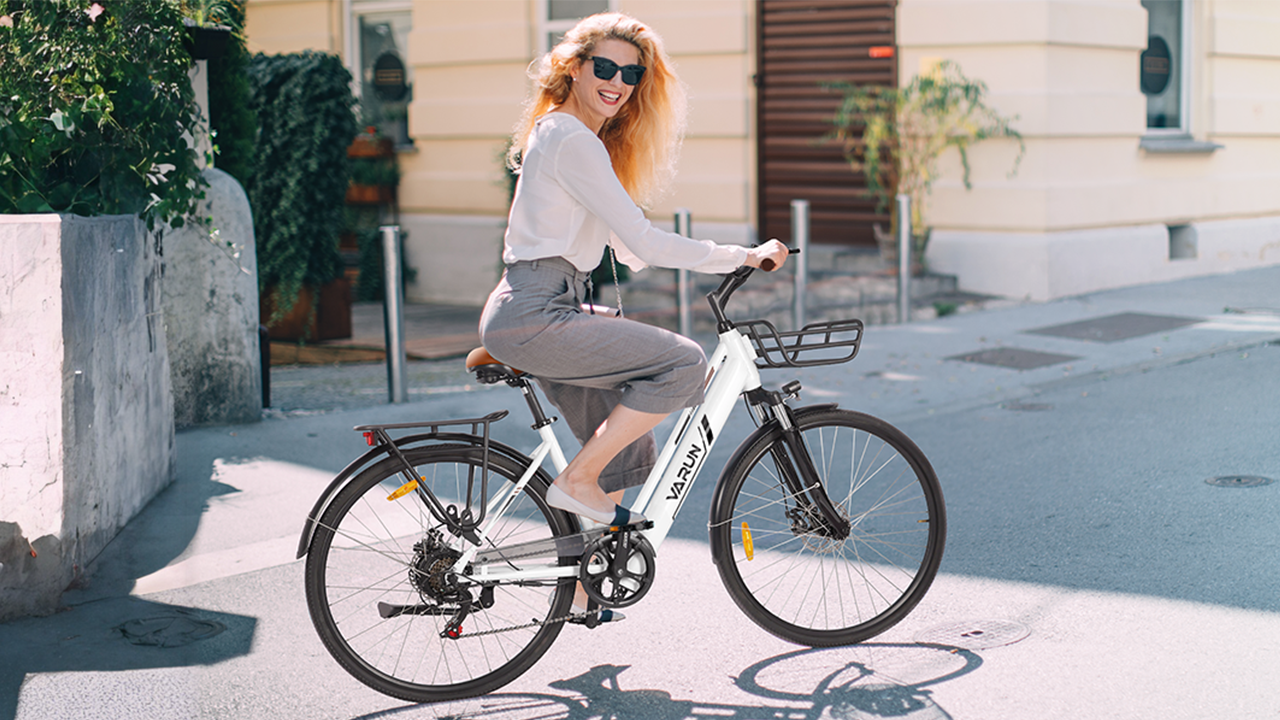 The woman riding the commute ebike on the street